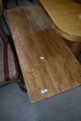 A golden oak coffee table, approx. 107 x 42cm