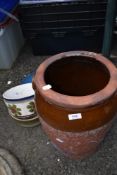 A vintage crock (no lid) and two continental style planters