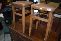 A pair of vintage kitchen stools