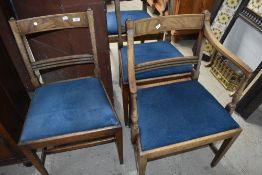 A set of four (two plus two) 19th Century mahogany dining chairs having later upholstered blue