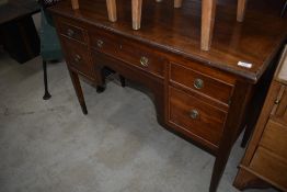 An Edwardian mahogany and inlaid desk or dressing table, in the Regency revival style
