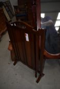 An early 20th Century mahogany fire screen