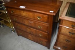 An early 20th Century mahogany chest of four long drawers, having period sty;e brass handles,