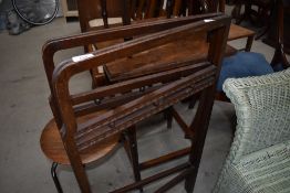 A vintage mahogany bifold clothes maid