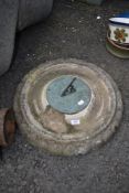 A concrete sundial top, and dial