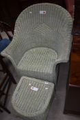 A painted wicker tub chair and footstool