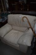 A cream leather easy chair