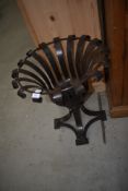 A modern reproduction wrought metal jardiniere or torchere stand