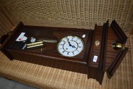 A reproduction mahogany cased wall clock