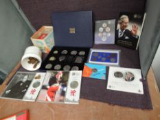 A collection of mainly GB Coins including four £5 coins on cards