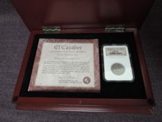A Franklin Mint Genuine Shipwreck Coin, El Cazador 2 Reales Silver Coin, in plastic case inside