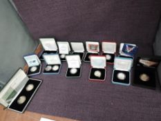A collection of 16 Queen Elizabeth II Royal Mint Silver Proof Two Pound Coins, 1986 Commonwealth