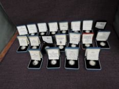 A collection of Nineteen Elizabeth II United Kingdom One Pound Silver Proof Coins in original