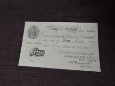 A Bank of England 1945 White Five Pound Note, chief cashier K.O.Peppiatt, K79 032850, small sticky