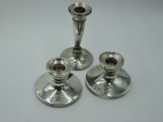 A pair of silver candle sticks of short circular form bearing inscription to front, Birmingham 1919,