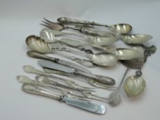 A selection of white metal flatware of various forms including cake slice, table spoons, forks
