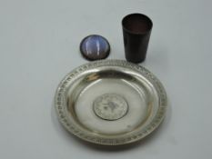 A German white metal tot glass stamped 800 of plain form, a white metal trinket dish having inset