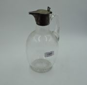 A Victorian glass claret jug of plain form having silver collar and lid with engraving of gent