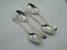 Four Georgian silver table spoons of Old English form bearing bull's head crest to terminals, London