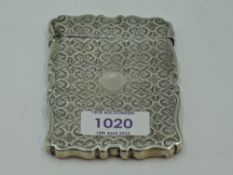 A Victorian silver card case having moulded and engraved decoration, Birmingham 1869, Frederick