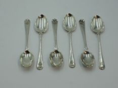 Six Victorian silver coffee spoons having monogrammed terminals and frilled and scalloped bowls,