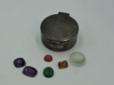 A small silver trinket box having engine turned decoration, plain cartouche and hinged lid,