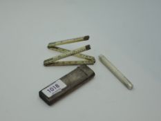 A silver pocket case containing a simulated ivory folding rule by J Rabone & Sons, and a