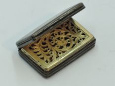 A Georgian silver vinaigrette of small form having engine turned decoration and gilt interior with