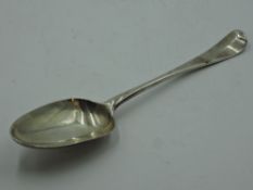 An early 18th Century Georgian silver table spoon of Hanoverian form bearing crest to reverse of