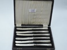 A cased set of six silver butter knives having facetted handles, Sheffield 1924/25, James Dixon &