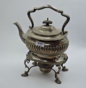 A silver spirit kettle having gadrooned decoration and monogram to side, gradrooned and scallop