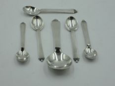 Five Danish silver coffee spoons by Georg Jensen in the pyramid design and a matching dessert