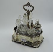 A Victorian silver condiment stand having engraved decoration, moulded rim and bracket feet,