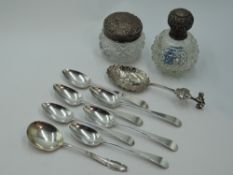 A small selection of HM silver including cut glass scent bottle and dressing table pot with silver