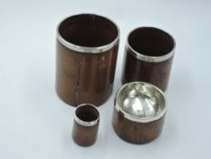 Four assorted wooden (burr wood) drinking (and other) utensils having silver collars/fittings,