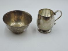 A two piece silver christening set comprising of mug and bowl, both bearing inscription,