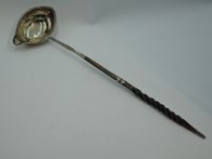 A Georgian silver toddy ladle having baleen twist handle with silver knop, London 1797, makers