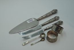 A small selection of HM silver including cake slice, cheese and grapefruit knives with silver