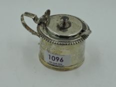 A Victorian silver mustard pot of plain cylindrical form having gadrooned rim and scallop shell