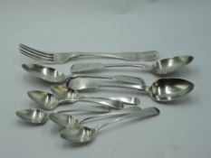 A selection of Georgian silver flatware including three Irish silver dessert spoons of fiddle rat