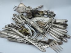 A selection of white metal/ plated cutlery of various forms
