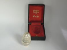 A Stuart Devlin limited edition silver gilt surprise egg (no: 46) having honeycomb style textured