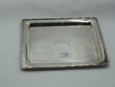 A Chinese silver dressing table tray of small rectangular form having rim modelled as bamboo and