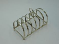 A silver 6 slice toast rack of plain arched form, Birmingham 1930, Adie Bros ltd, approx 115.6g
