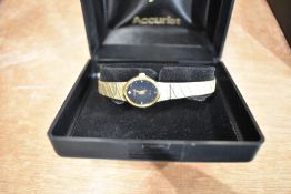 A ladies Accurist gold tone wristwatch, slight damage to bracelet