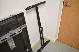 A musical keyboard or similar stand
