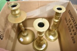 Three brass candle sticks.
