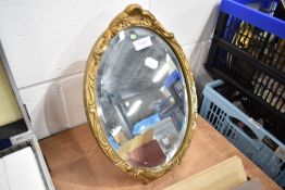 An antique gesso and gilt framed dressing table mirror