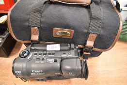 A Canon UC-X30Hi 8mm video camcorder in soft carry bag