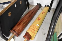 Two Chinese paper and bamboo parasols